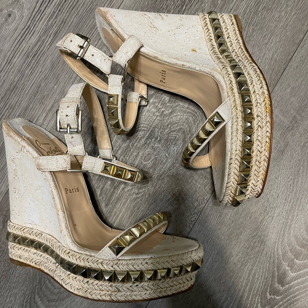 CHRISTIAN LOUBOUTIN
Pyraclou leather wedge sandals